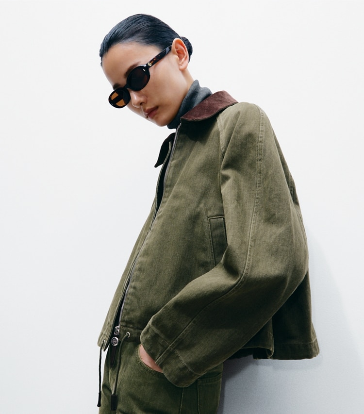 Tory Burch designer jackets Denim Bomber Jacket in Distressed Green on model detail