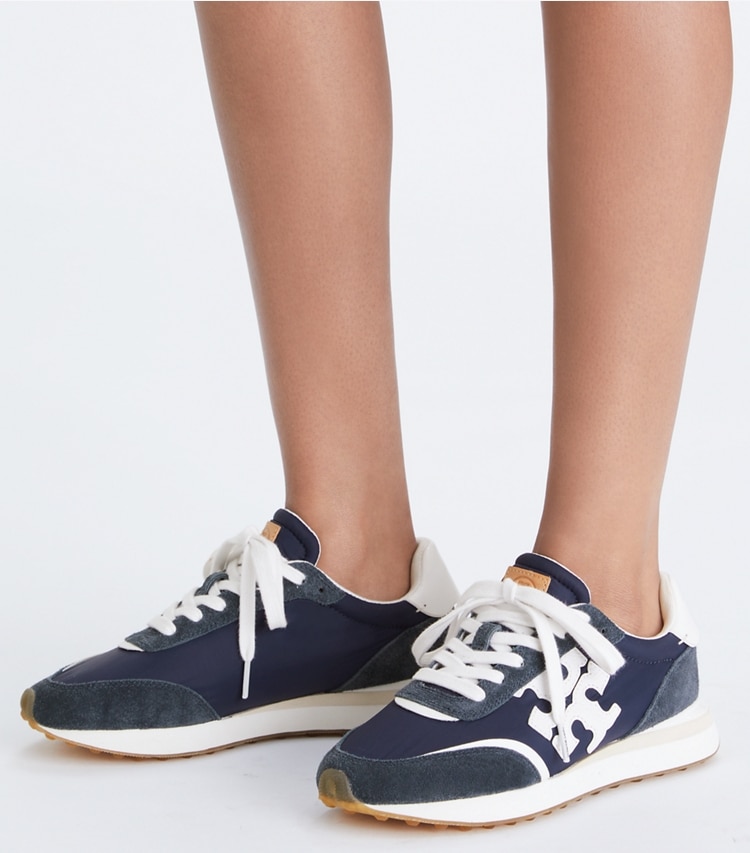 Tory Burch designer sneakers Destiny Trainer in RETRO NAVY/ RETRO NAVY/ WHITE additional on model