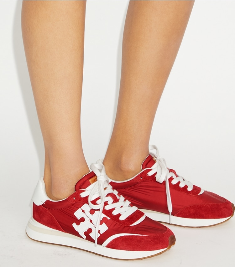 Tory Burch designer sneakers Destiny Trainer in TORY RED / TORY RED / WHITE additional on model