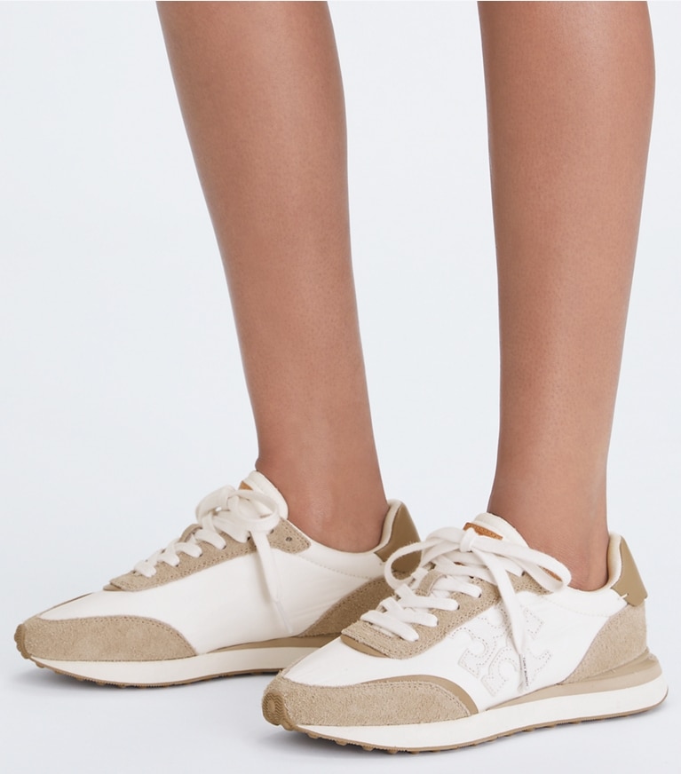 Tory Burch designer sneakers Destiny Trainer in WHITE / WHITE / AVOLA angle