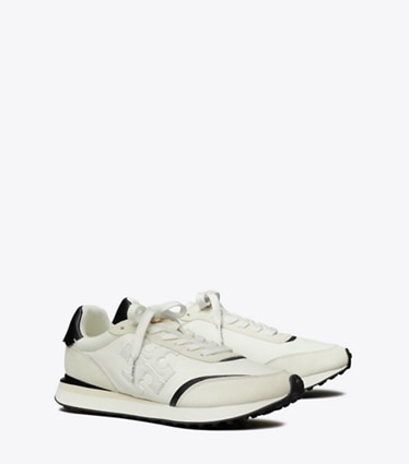 Tory Burch designer sneakers Destiny Trainer in WHITE / WHITE / BLACK angle