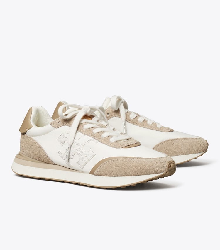 Tory Burch designer sneakers Destiny Trainer in WHITE / WHITE / AVOLA angle