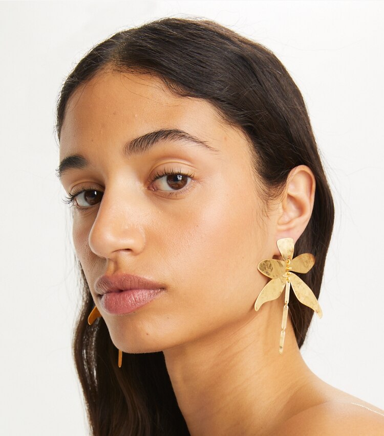 Tory Burch designer earrings Dragonfly Earring in Rolled Light Brass accessory on model