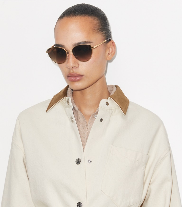 Tory Burch designer sunglasses & eyewear Eleanor Chain Cat Eye in SHINY GOLD/ BROWN GRADIENT accessory on model