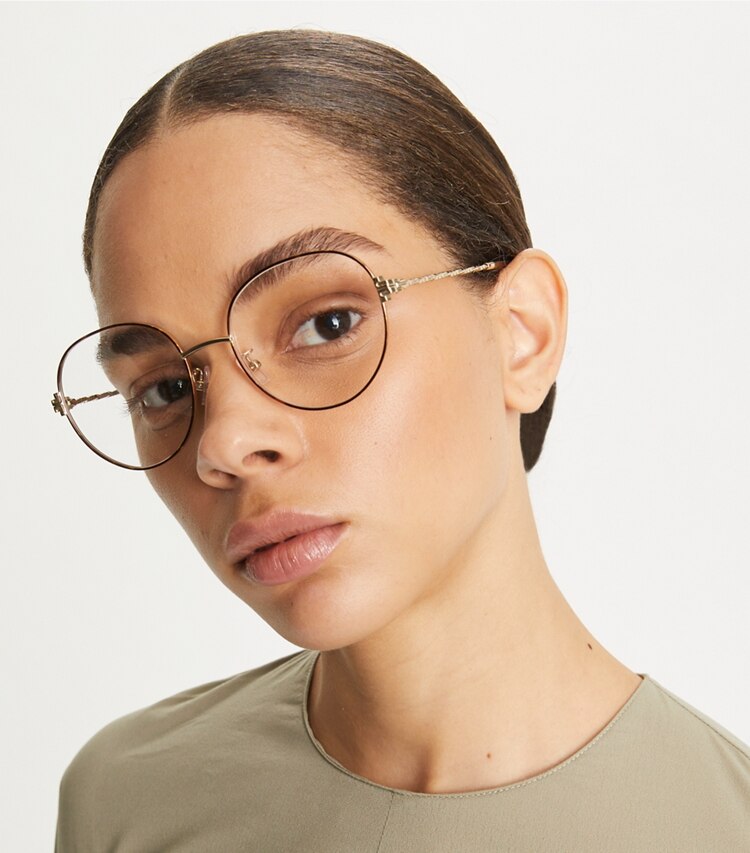 Tory Burch designer sunglasses & eyewear Eleanor Metal Round Eyeglasses in SHINY LIGHT GOLD accessory on model