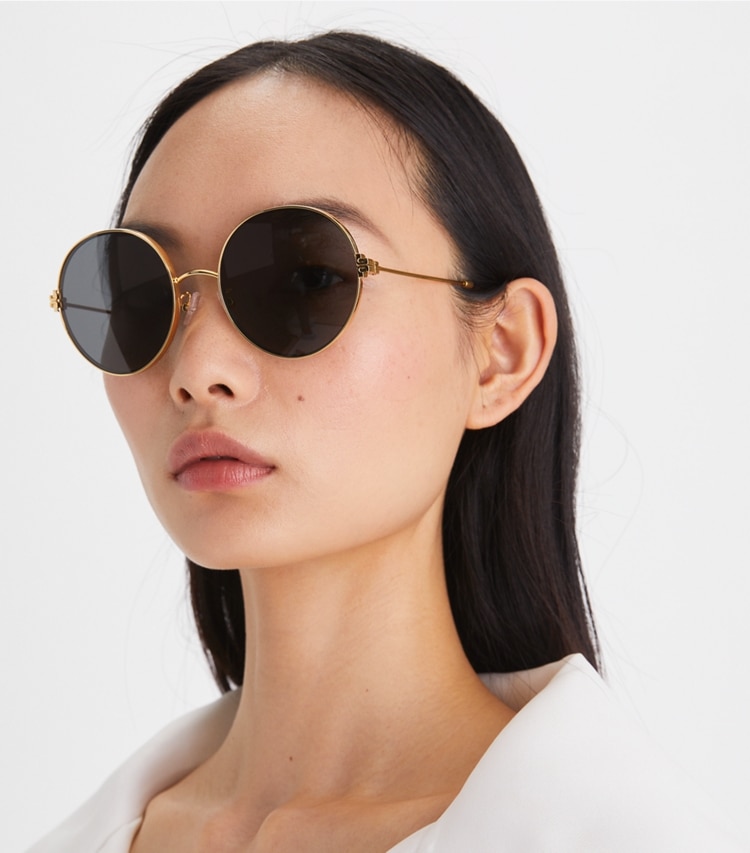 Tory Burch designer sunglasses & eyewear Eleanor Metal Round Sunglasses in SHINY SILVER/DARK BLUE MIRROR accessory on model