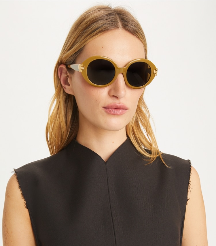 Tory Burch designer sunglasses & eyewear Eleanor Oval Sunglasses in BLACK/IVORY/DARK GREY SOLID accessory on model