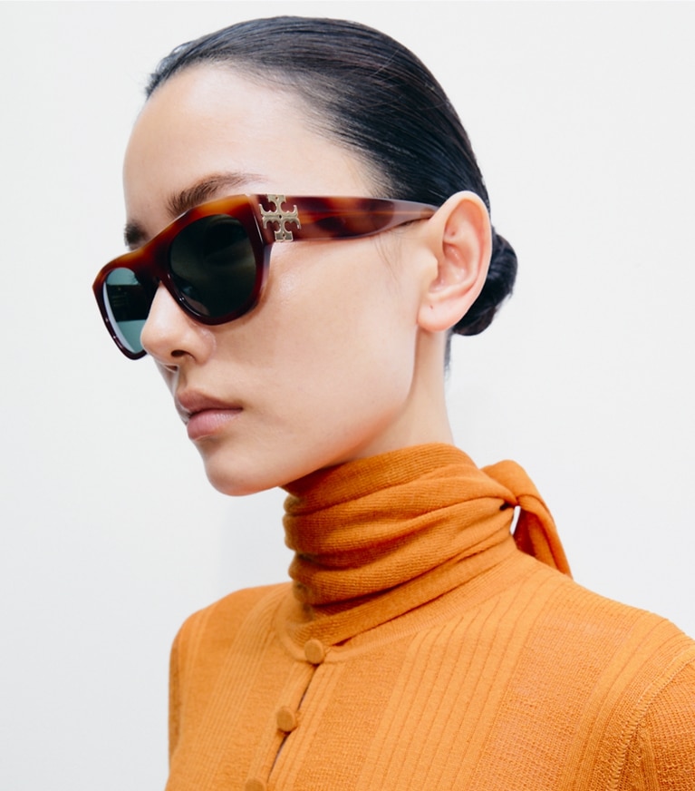 Tory Burch designer sunglasses & eyewear Eleanor Oval Sunglasses in GREEN MARBLED/BROWN accessory on model