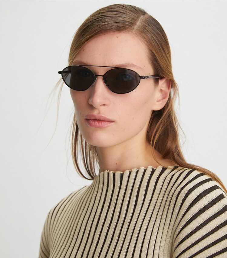 Tory Burch designer sunglasses & eyewear Eleanor Oval Sunglasses in GOLD/MILKY AMBER accessory on model