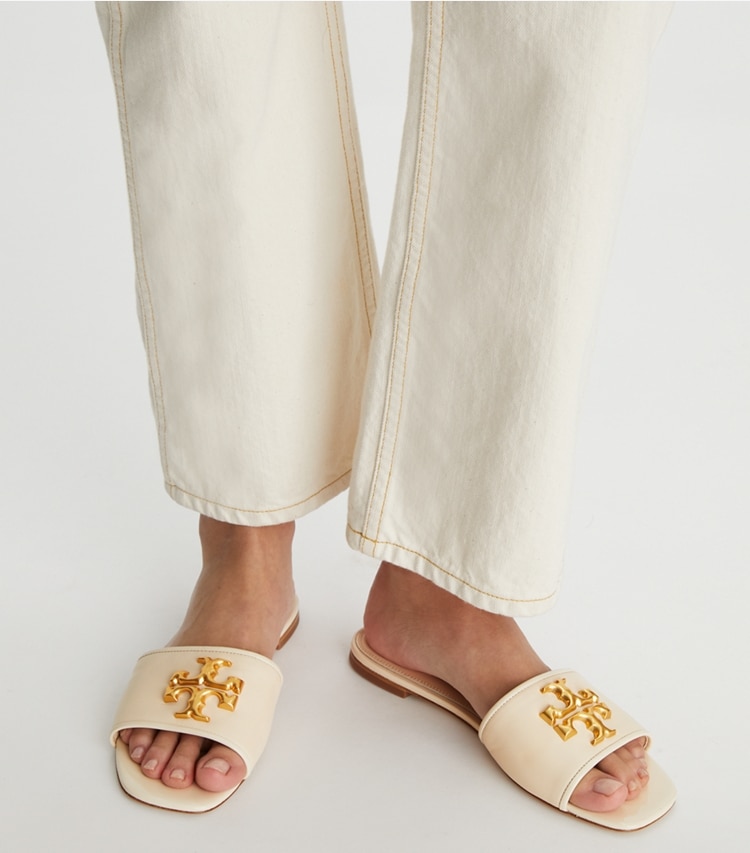 Tory Burch designer sandals Eleanor Slide in New Cream accessory on model
