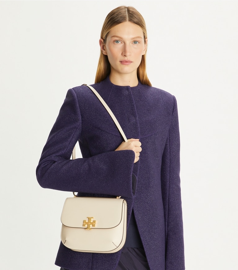 Tory Burch designer shoulder bags Eleanor Slim Saddlebag in New Cream accessory on model
