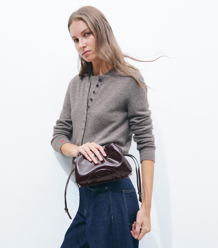 Tory Burch designer crossbody bags Ella Distressed Drawstring Pouch in Mulberry additional on model