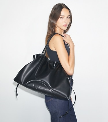 Tory Burch designer tote bags Ella Drawstring Tote in Black accessory on model