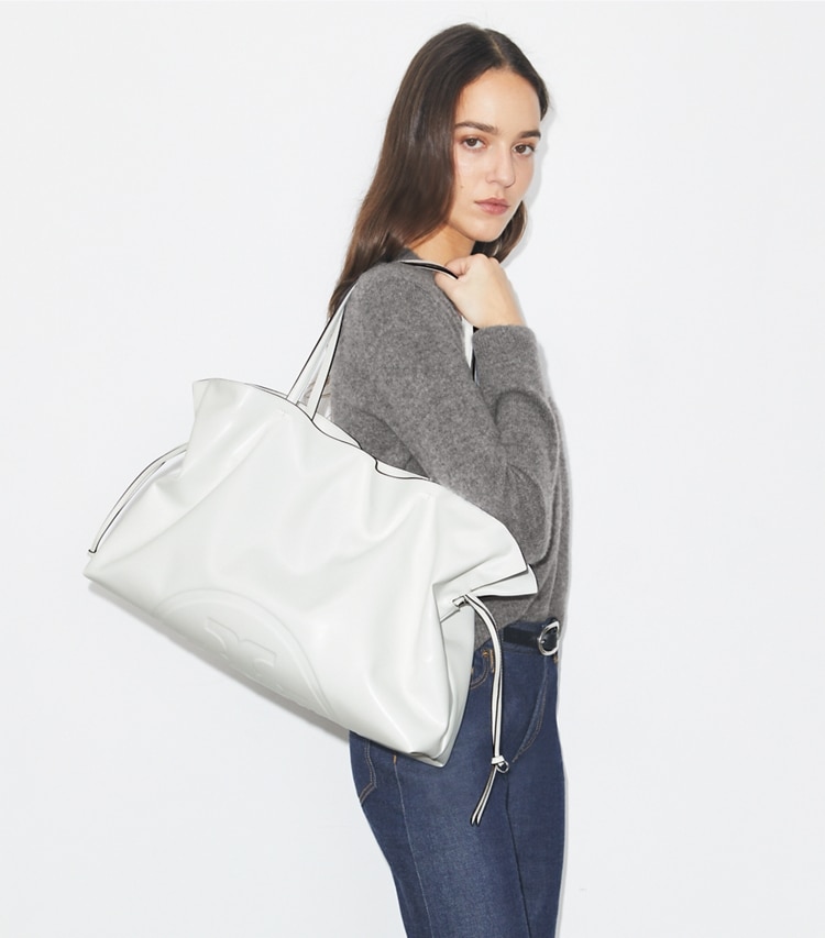 Tory Burch designer tote bags Ella natuura™ Drawstring Tote in Bianco accessory on model