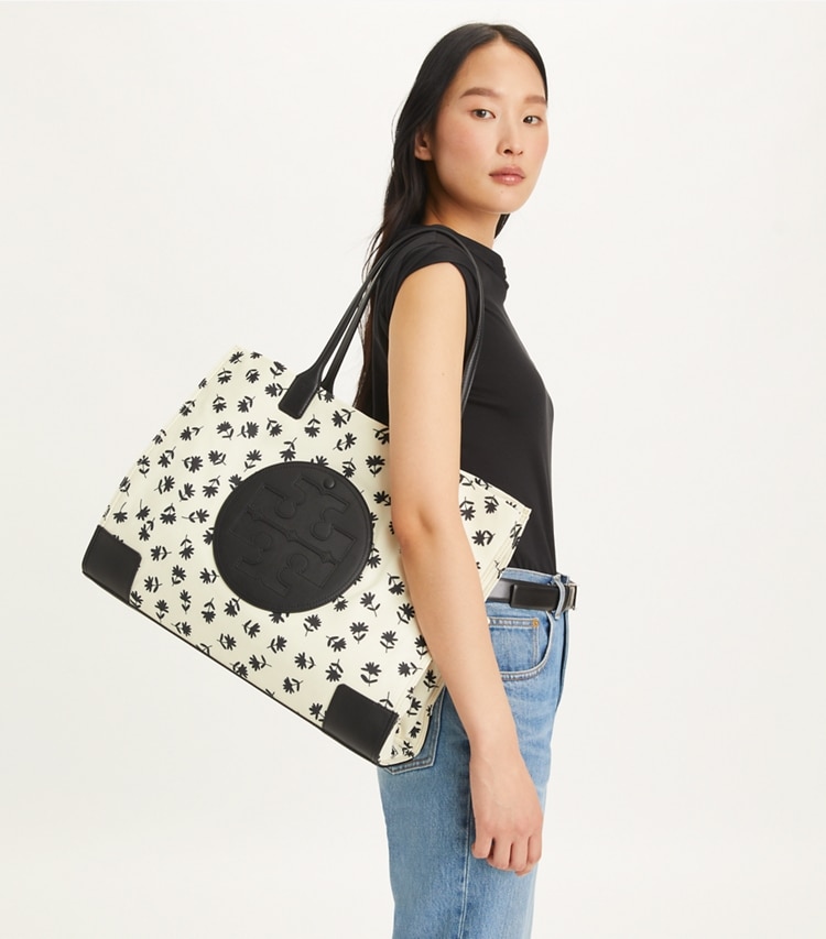 Tory Burch designer tote bags Ella Printed Tote in Black Multi Scatter Daisy accessory on model