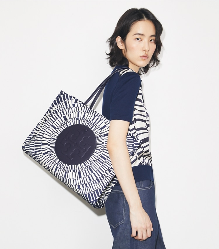 Tory Burch designer tote bags Ella Printed Tote in Navy Circle accessory on model