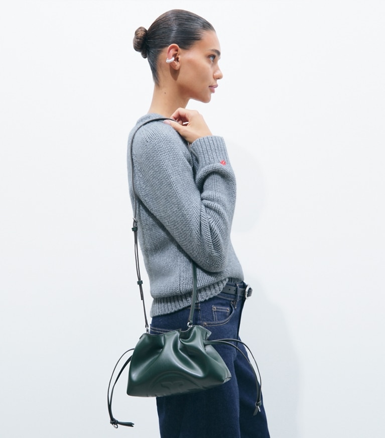 Tory Burch designer crossbody bags Ella Recycled Drawstring Pouch in Pine Tree accessory on model