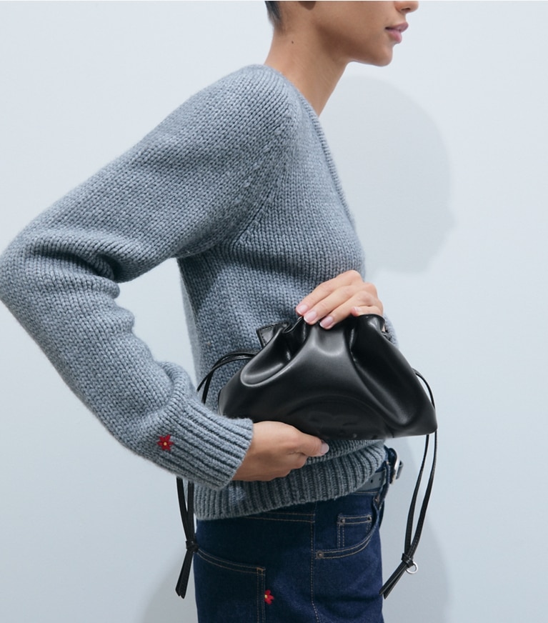 Tory Burch designer crossbody bags Ella Recycled Drawstring Pouch in BLACK additional on model