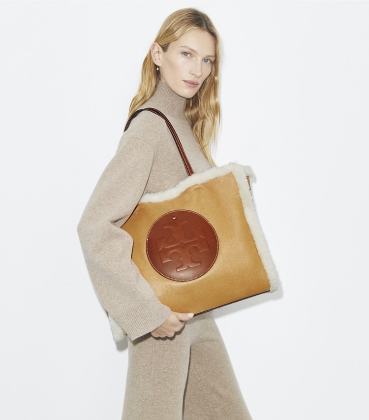 Tory Burch designer tote bags Ella Shearling Tote in LIGHT NATURAL / Brown accessory on model