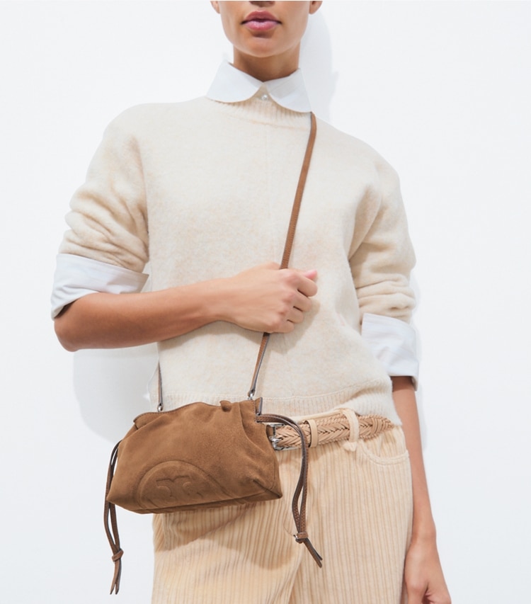 Tory Burch designer crossbody bags Ella Suede Drawstring Pouch in Caramel accessory on model