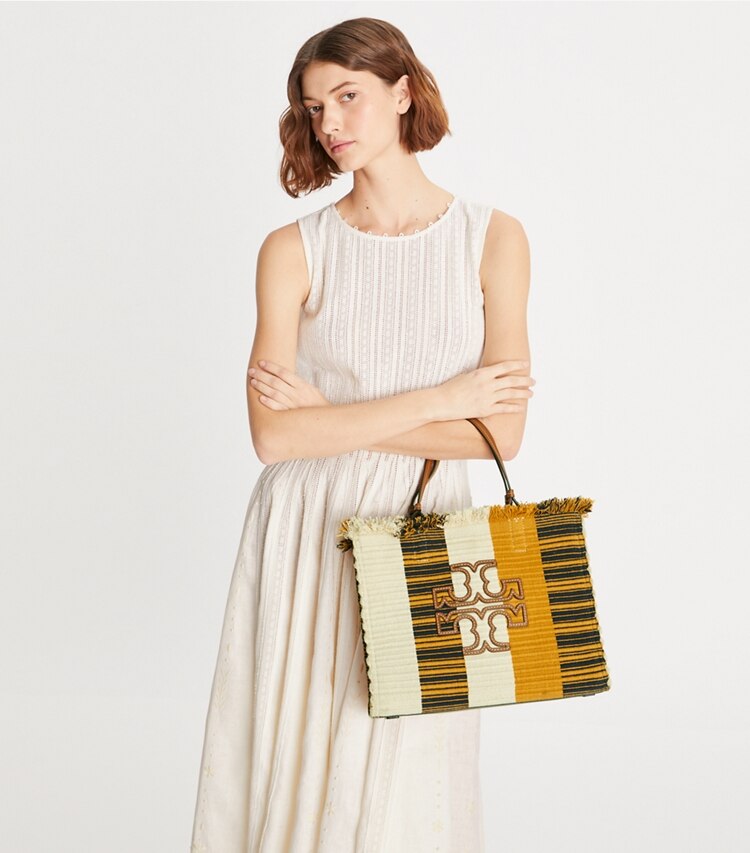 Tory Burch designer tote bags Ella Woven Stripe Tote in Chutney / Natural accessory on model
