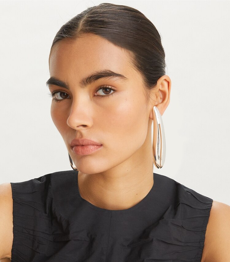 Tory Burch designer earrings Elongated Wave Earring in Light Silver accessory on model