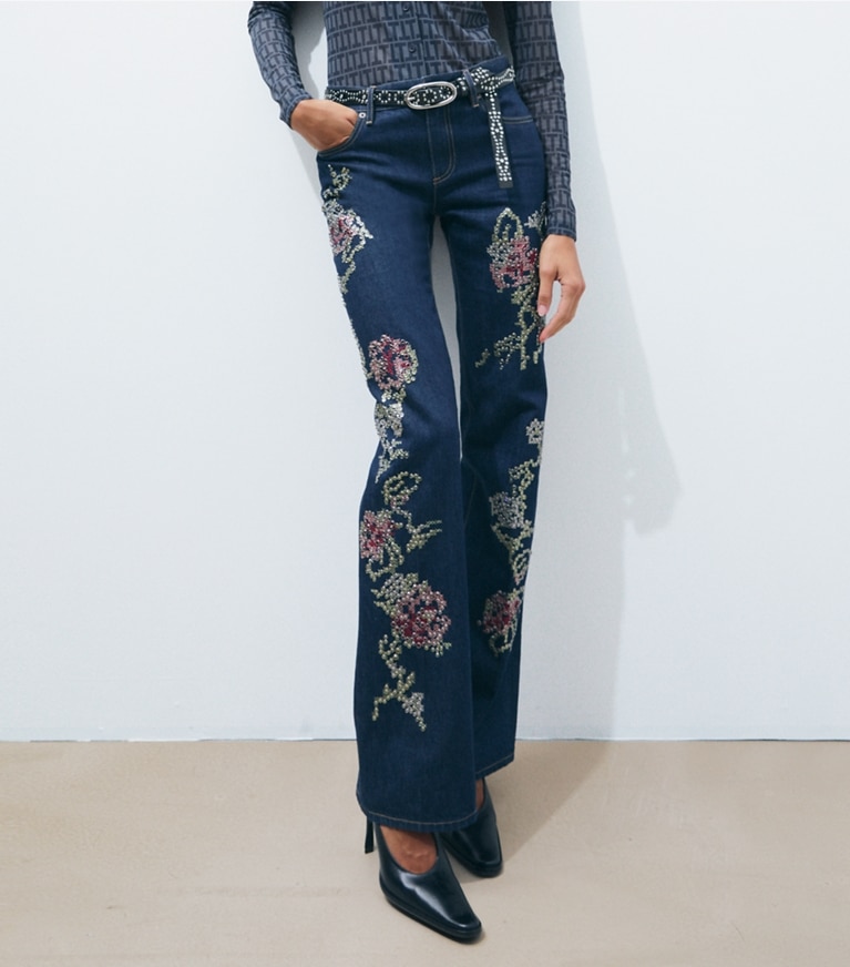 Tory Burch designer bottoms Embellished Bootcut Jean in Raw/Unwashed Vintage Selvedge Denim on model detail