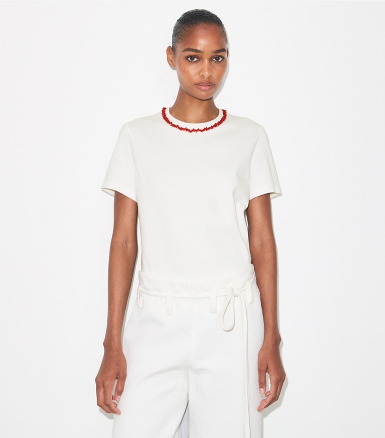 Tory Burch designer tops Embellished Cotton T-Shirt in Snow White / Bright Red on model detail