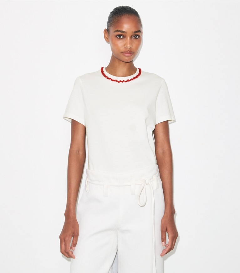 Tory Burch designer tops Embellished Cotton T-Shirt in Snow White / Bright Red on model detail