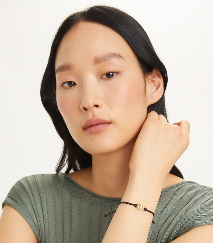 Tory Burch designer bracelets Embrace Ambition Logo Bracelet in Tory Silver / Light Blue accessory on model
