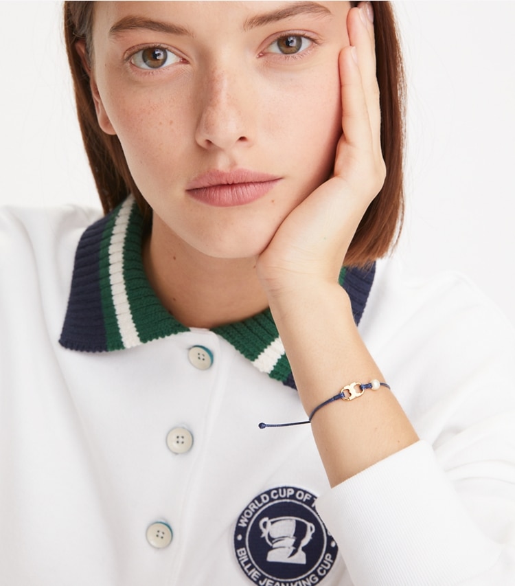Tory Burch designer bracelets Embrace Ambition Pearl Bracelet in Tory Gold / Tory Navy / Creme accessory on model