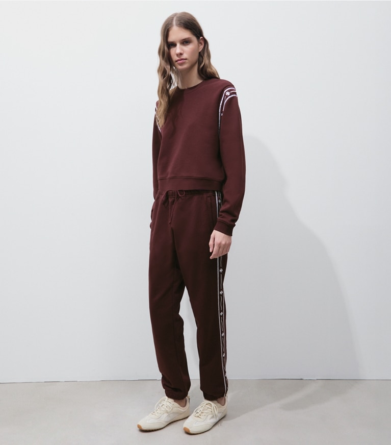 Tory Burch designer sweaters Embroidered French Terry Sweatshirt in Merlot on model front