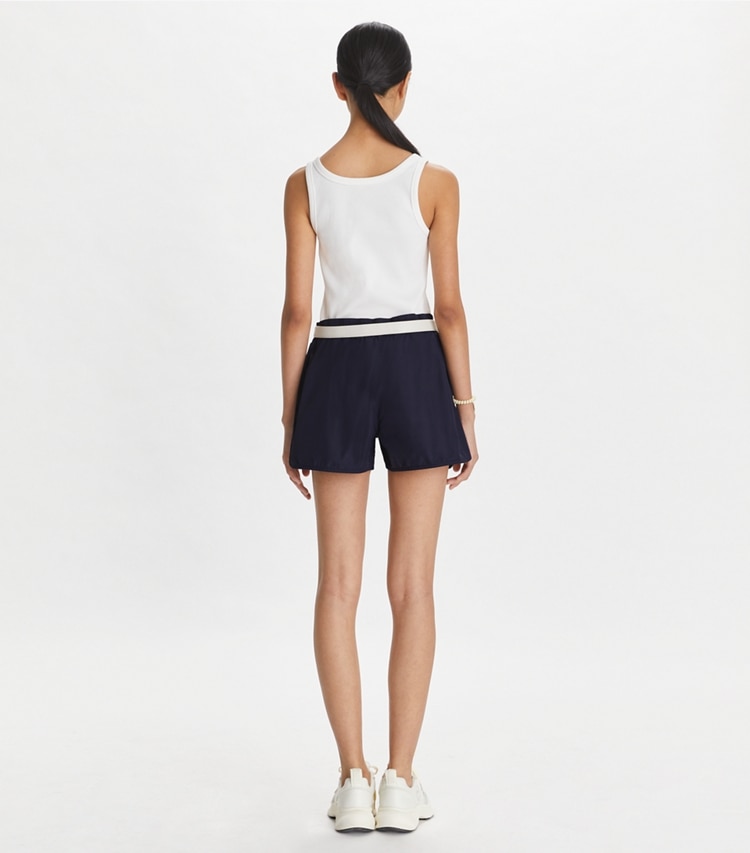 Tory Sport designer bottoms Embroidered Logo Nylon Short in Deep Navy on model back