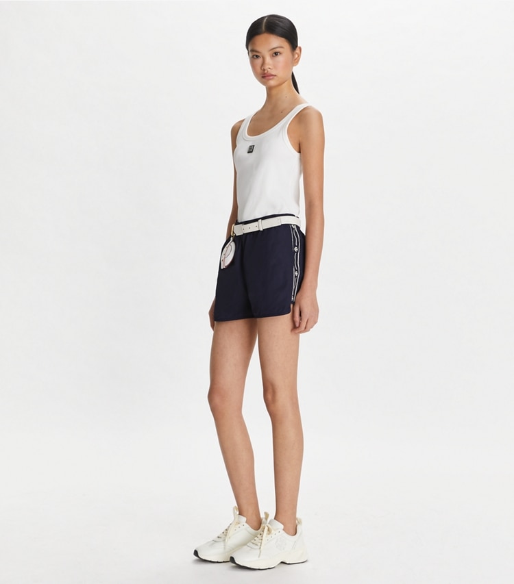 Tory Sport designer bottoms Embroidered Logo Nylon Short in Deep Navy on model front