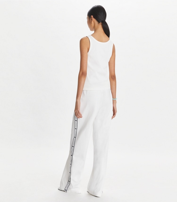 Tory Sport designer bottoms Embroidered Logo Nylon Track Pant in Snow White on model back