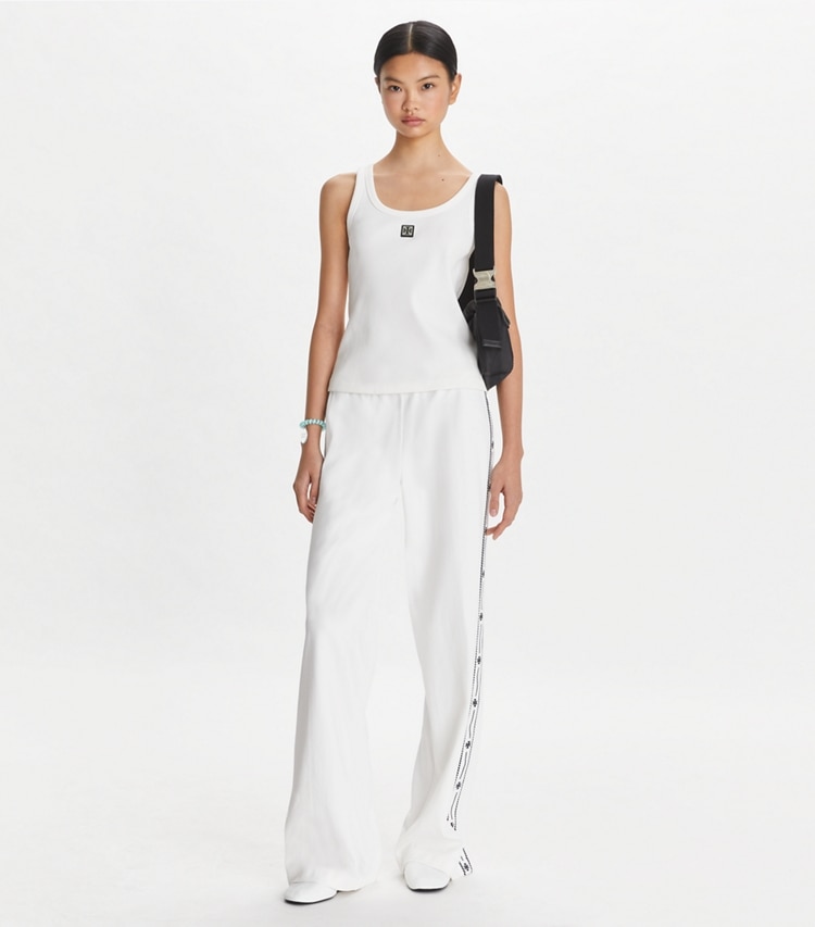 Tory Sport designer bottoms Embroidered Logo Nylon Track Pant in Snow White on model front
