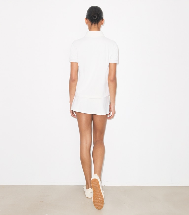 Tory Burch designer tops Embroidered Logo Tennis Polo in Snow White on model back