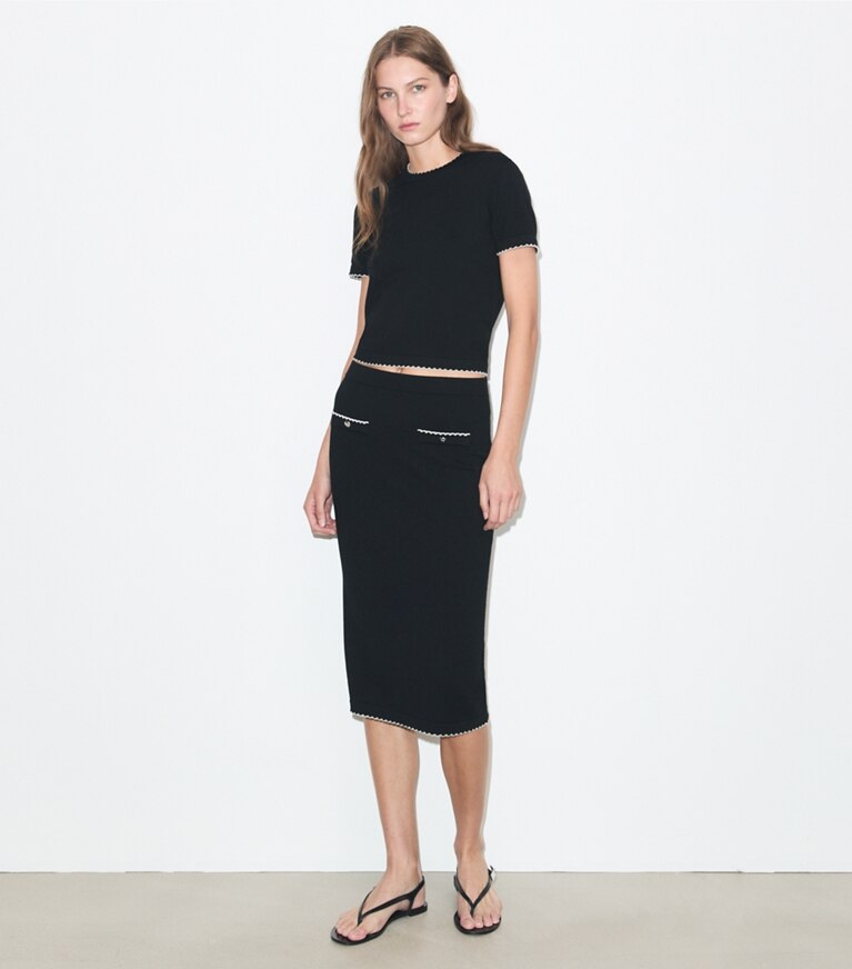 Tory Burch diseñador prendas inferiores Falda festoneada de lana en Black / New Ivory frente en modelo
