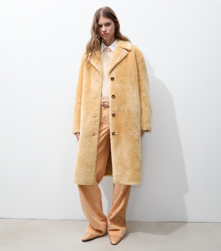 Tory Burch designer coats Faux Shearling Coat in Oatmeal on model front