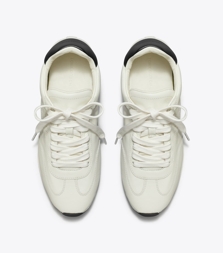 Tory Burch designer sneakers Field Sneaker in BLANC / PERFECT BLACK angle