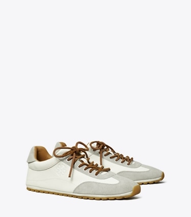 Tory Burch designer sneakers Field Sneaker in BLANC / LOUTRE GRAY angle
