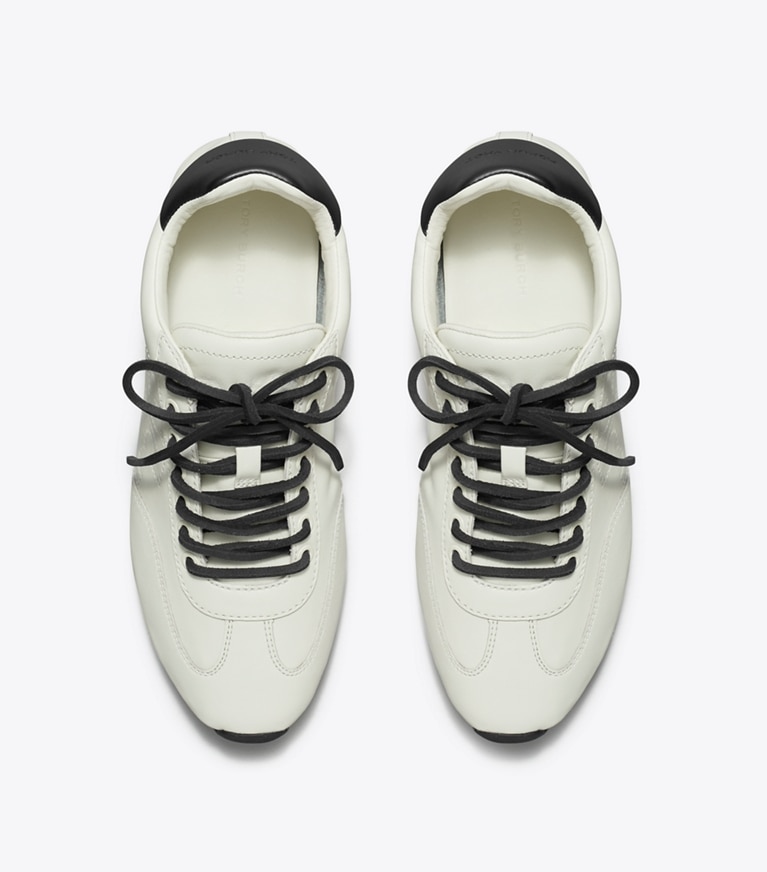 Tory Burch designer sneakers Field Sneaker in BLANC / PERFECT BLACK angle