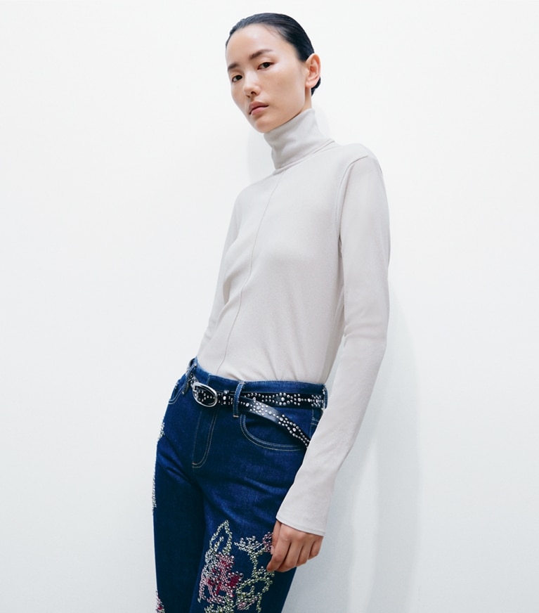 Tory Burch designer tops Fine Rib Turtleneck in Gray Green on model detail