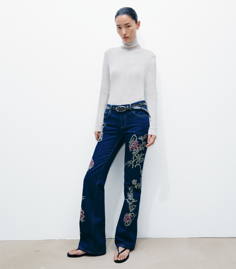 Tory Burch designer tops Fine Rib Turtleneck in Gray Green on model front