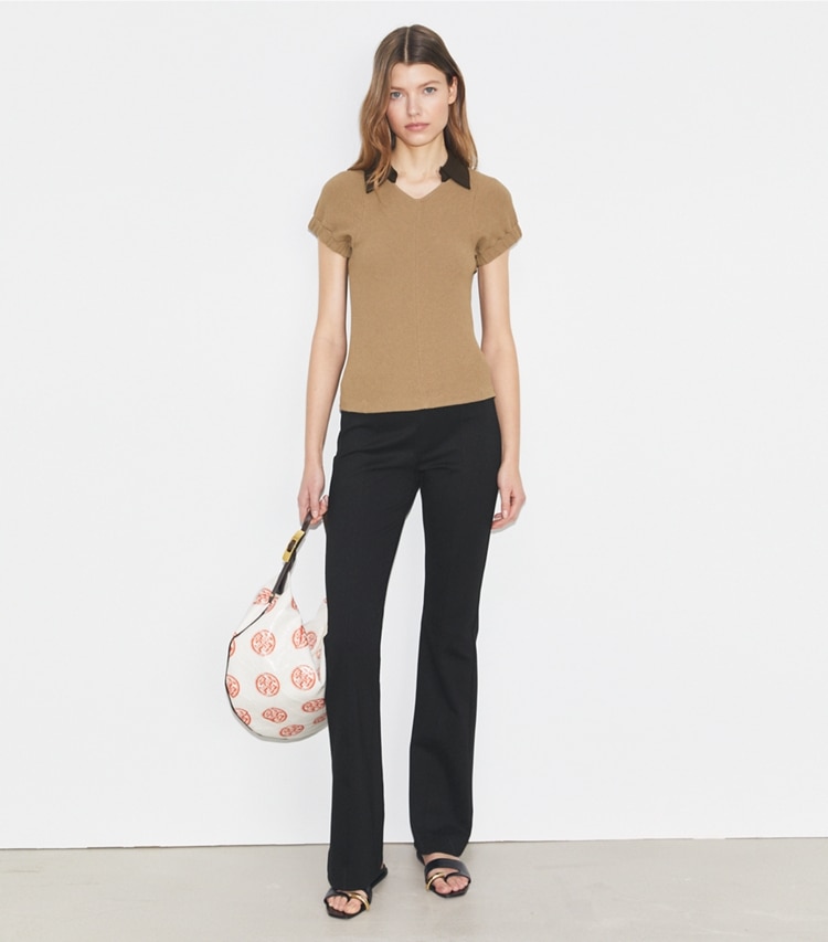 Tory Burch designer bottoms Flared Compression Pant in Black on model front