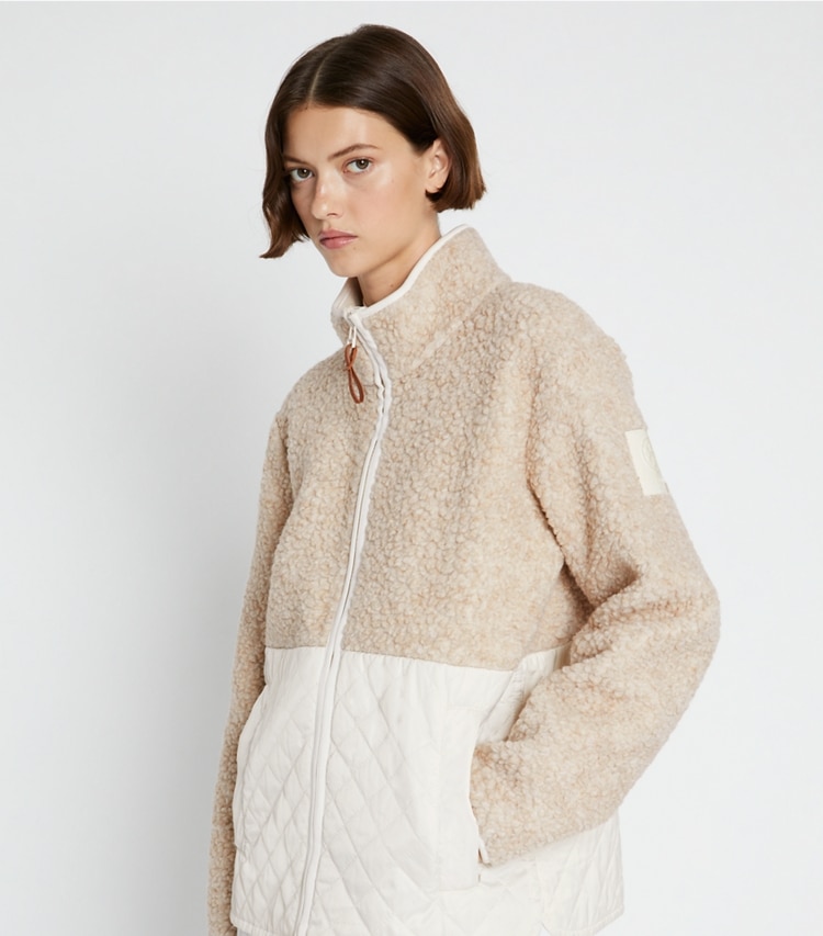 Tory Sport designer coats Fleece Quilted Jacket in Natural Heather / French Cream on model detail