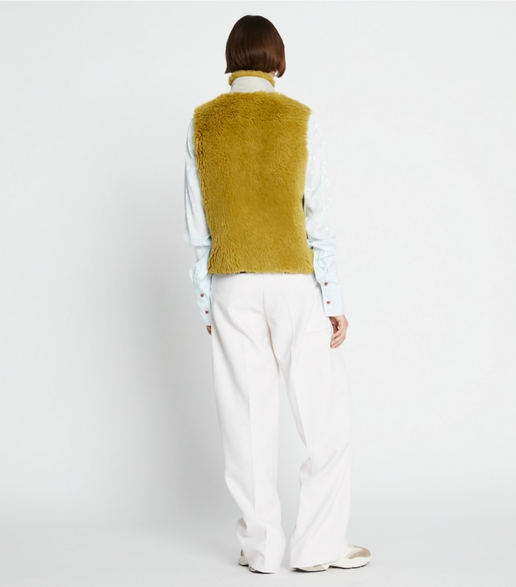 Tory Sport designer coats Fleece Zip Vest in Olive Grove on model back