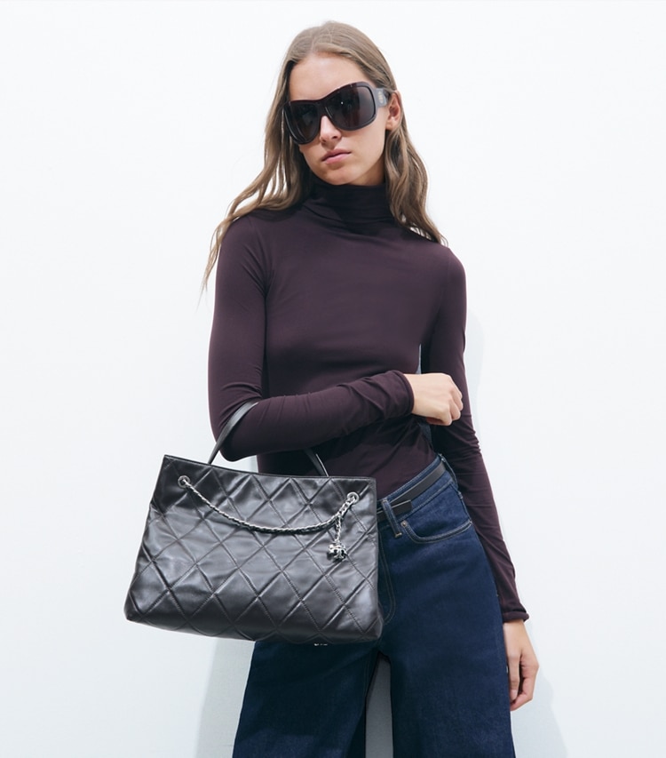 Tory Burch designer satchels Fleming Carryall in Cocoa additional on model