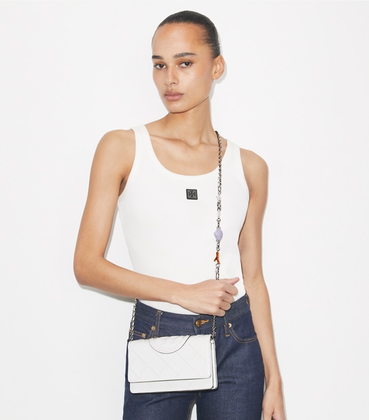 Tory Burch designer mini bags Fleming Charm Chain Crossbody in Cirrus Cloud accessory on model