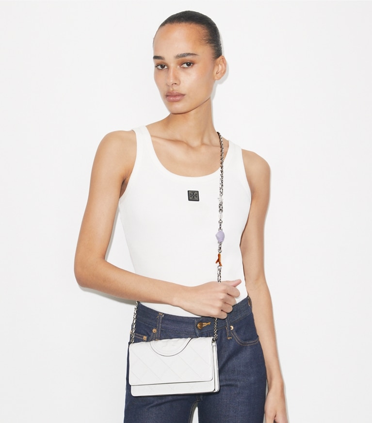 Tory Burch designer mini bags Fleming Charm Chain Crossbody in Cirrus Cloud accessory on model